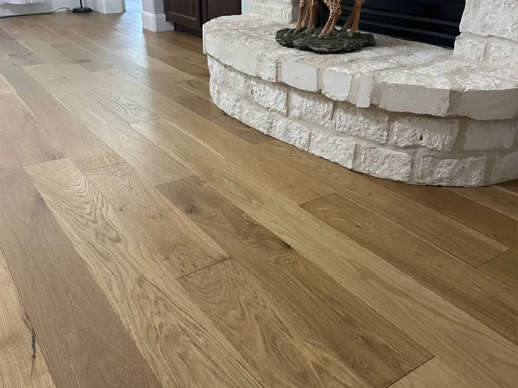 Premium oak hardwood flooring installation in San Antonio living room by Pride Floors