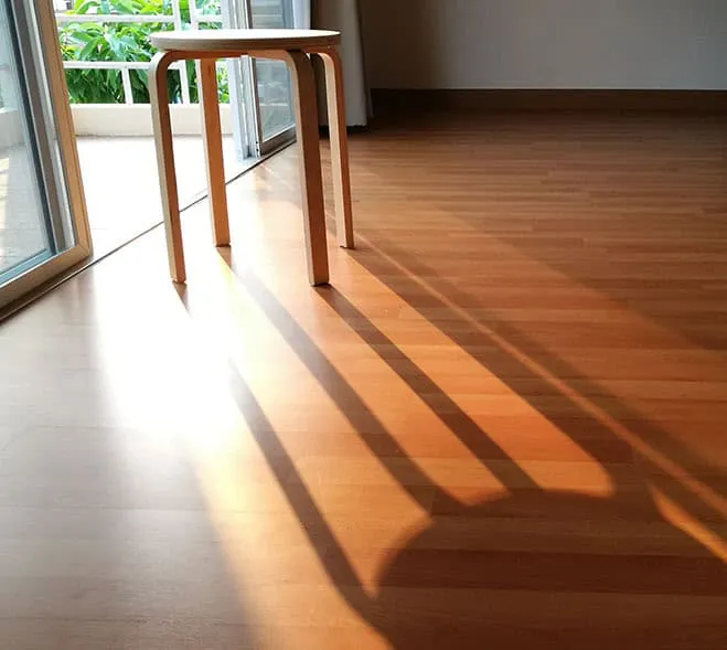 Natural sunlight on hardwood flooring showing UV protection importance