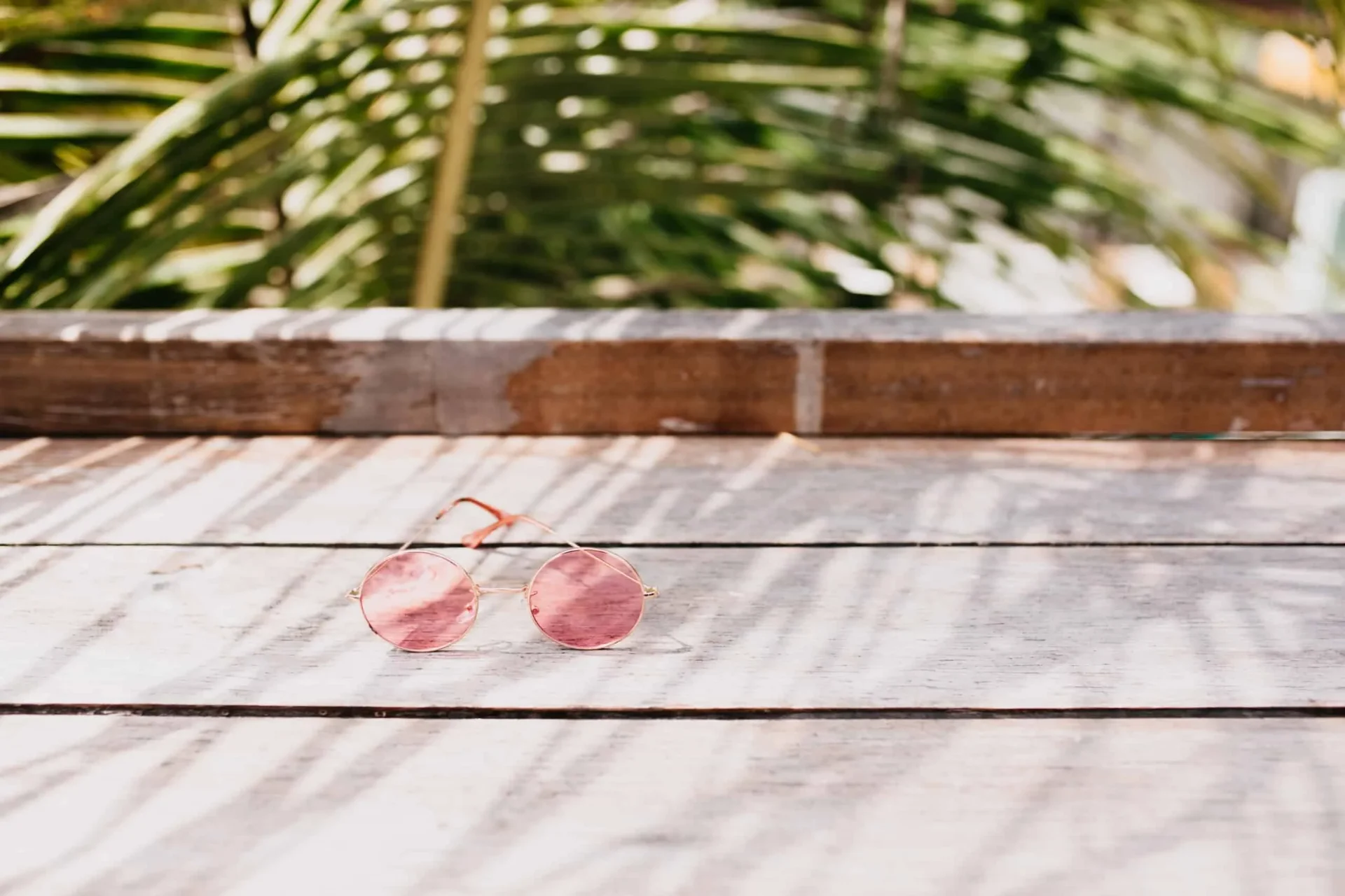 Stylish summer accessories on wooden table showcasing flooring trends