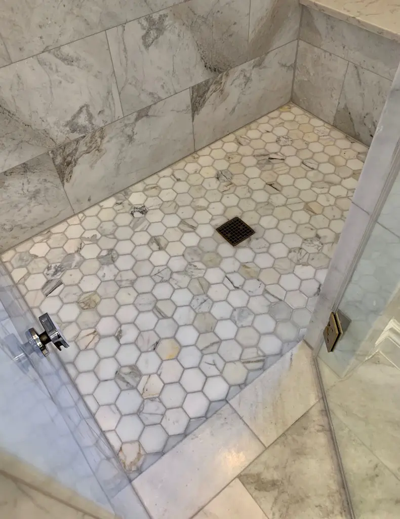 Custom Remodel Hexagon Tile Shower White Hex Marble Bathroom Remodeling & Tile flooring installation in San Antonio, TX by Pride Floors