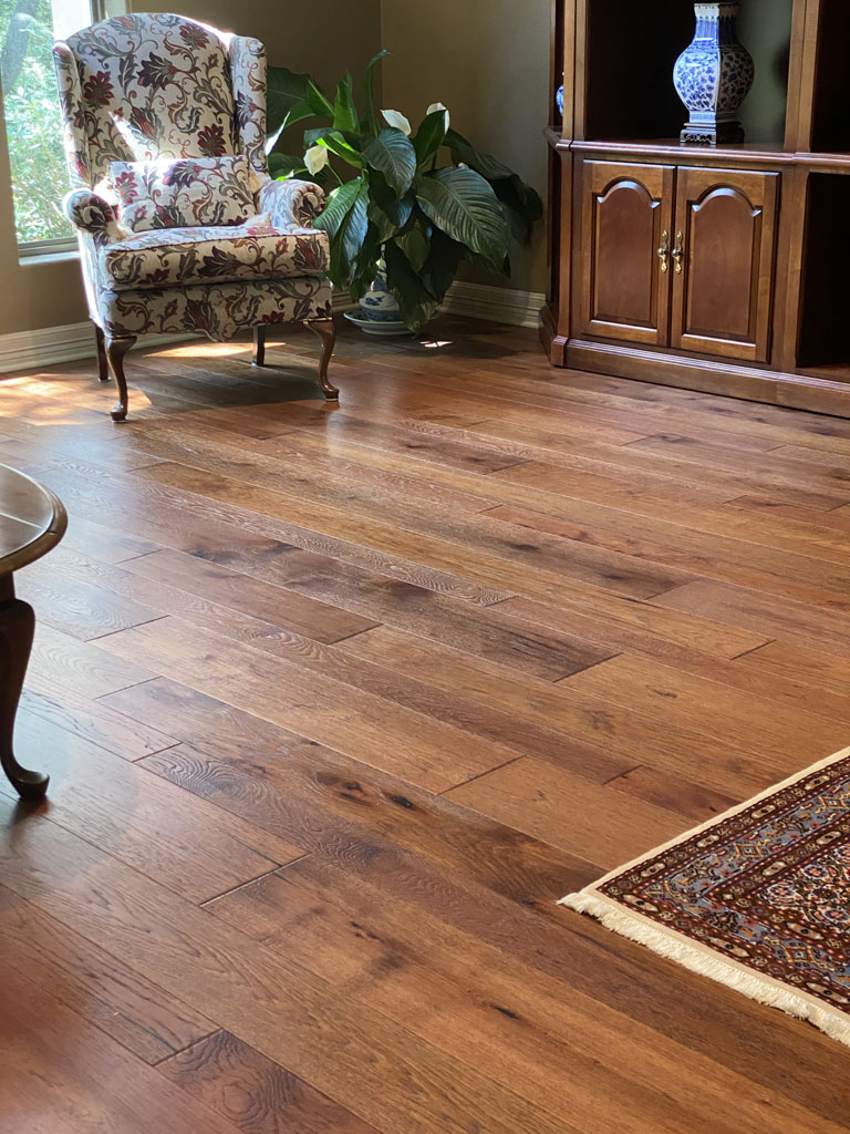 Photo of installed hardwood flooring in a living room