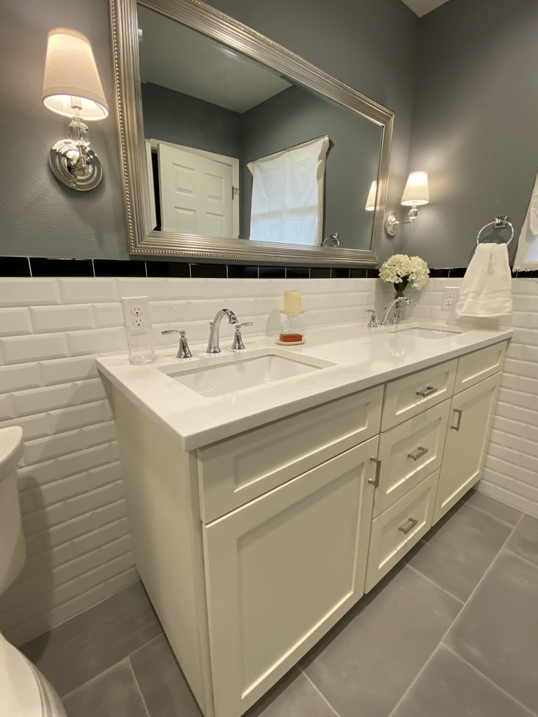Photo of a bathroom remodel with tile and a sink