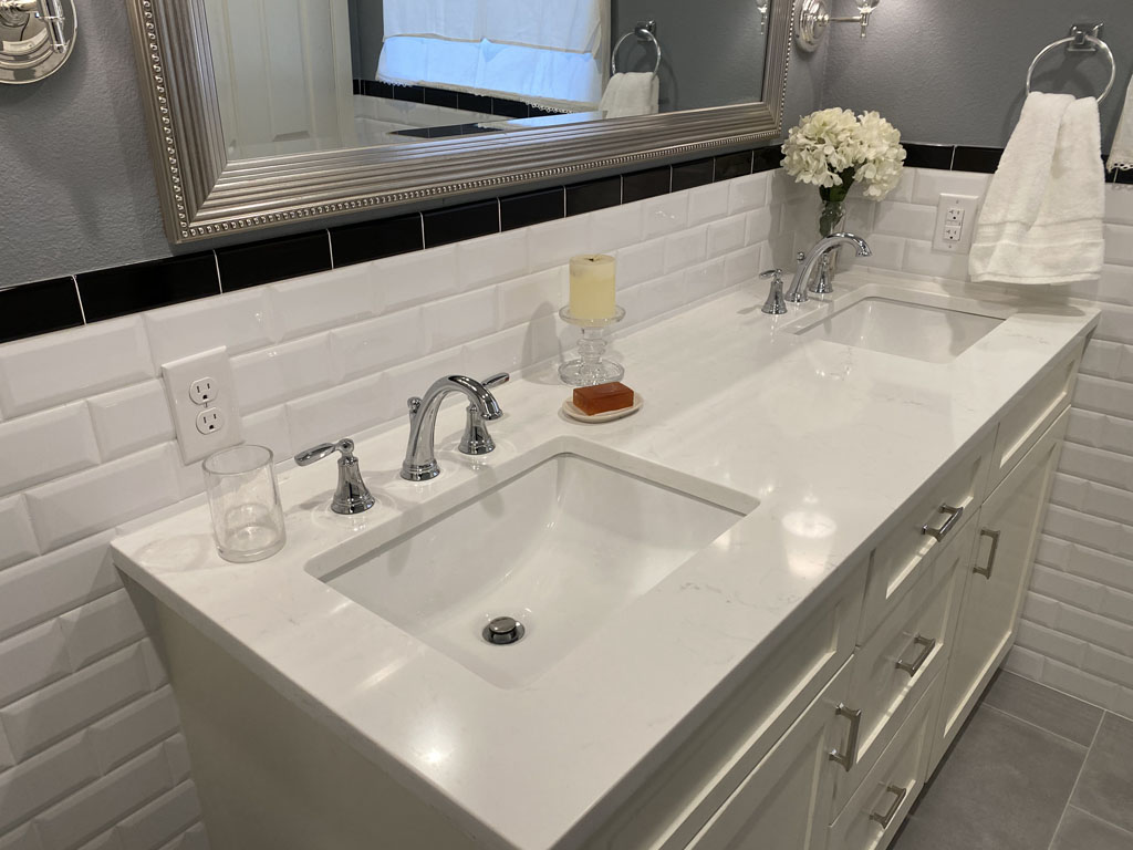 Picture of a bathroom remodeled vanity & sink with tile backsplash