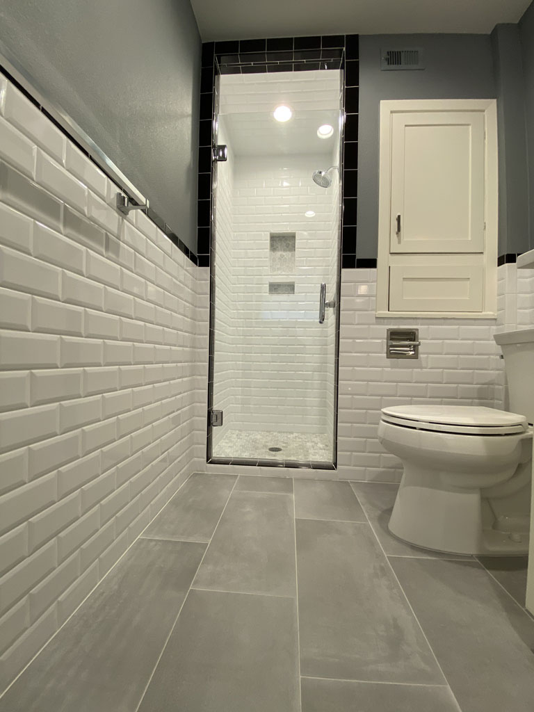 Picture of a bathroom remodel with tile wall, tile flooring, and a tiled stand-in shower
